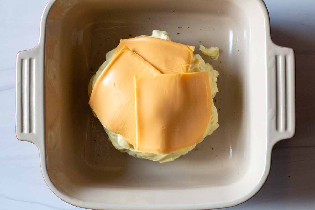 Adding american cheese slices to microwave cauliflower