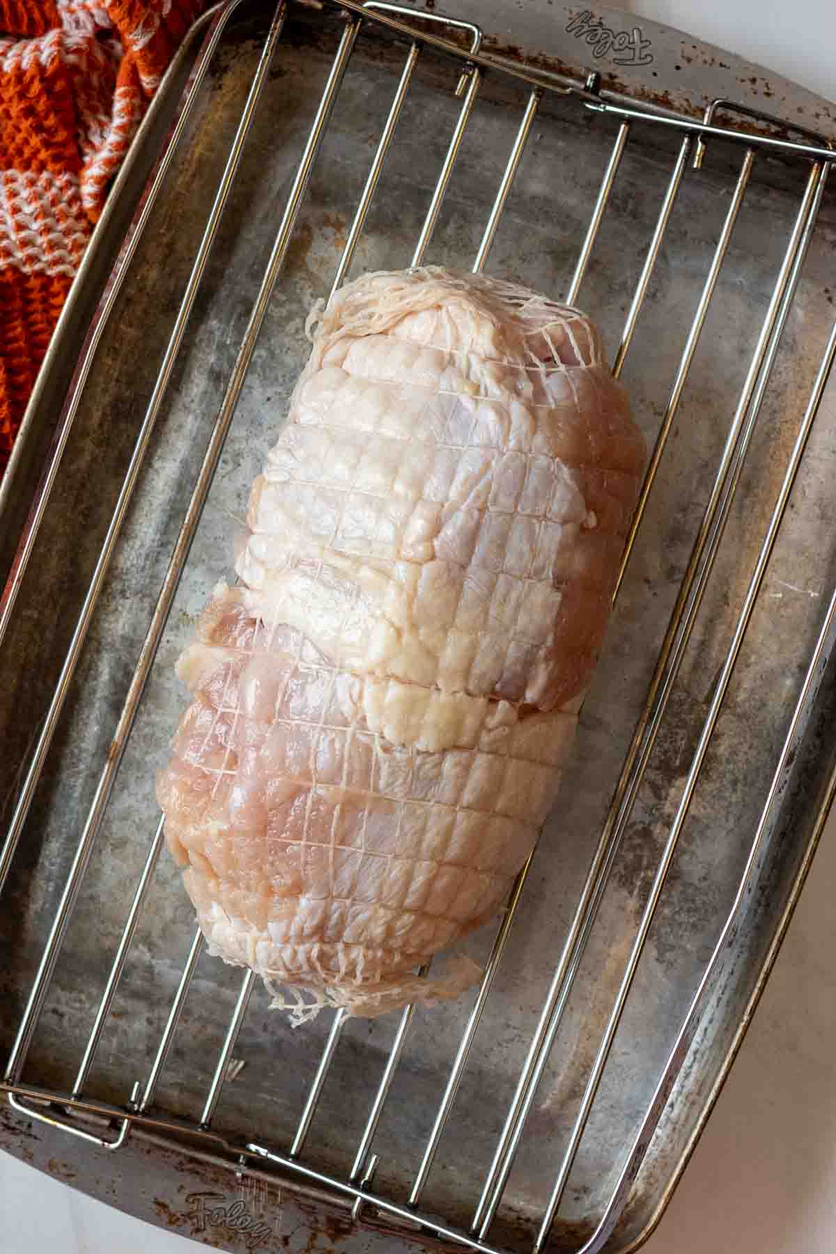 Step 3: A boneless turkey breast roast on a roasting pan.