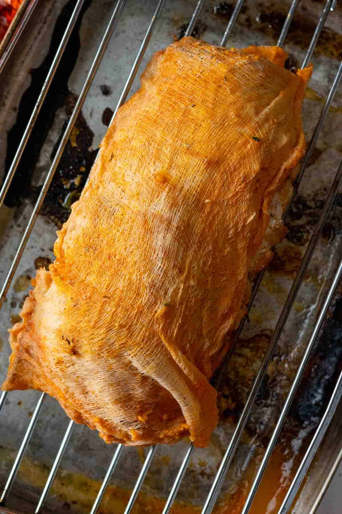 Step 4: Placing cheesecloth on a boneless turkey breast roast.