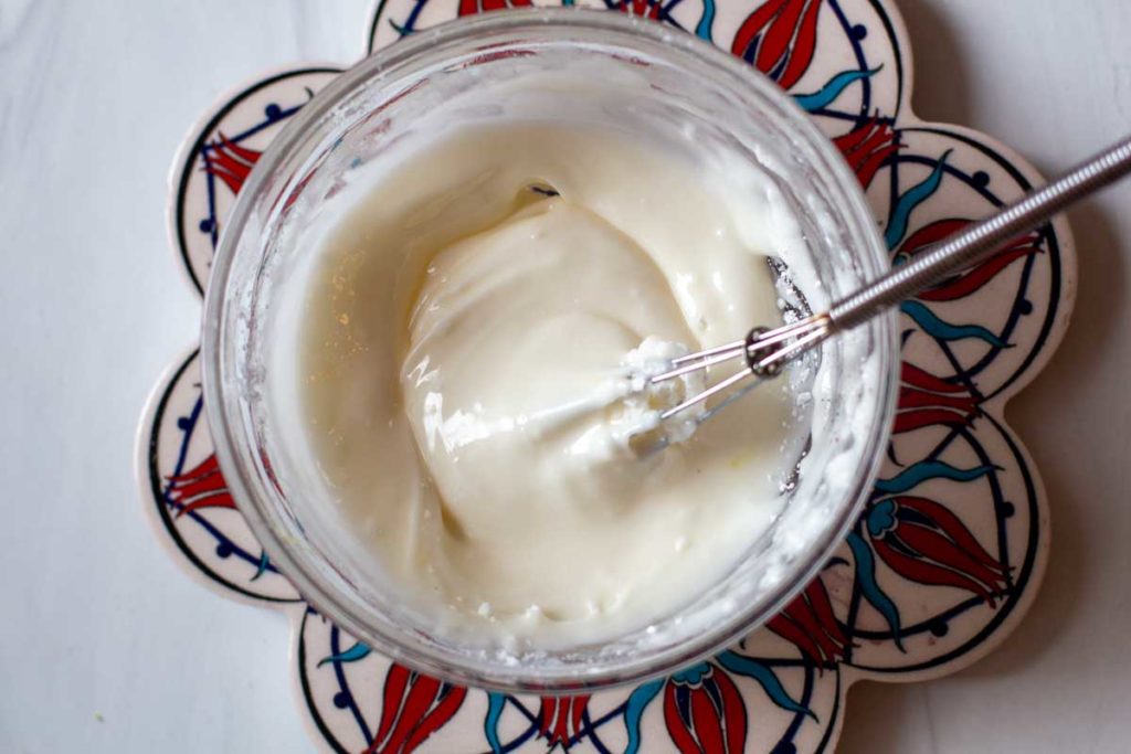 Making frosting for orange pound cake recipe
