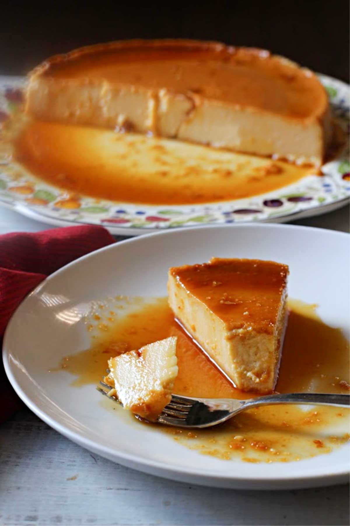 A slice of cream cheese flan with caramel sauce