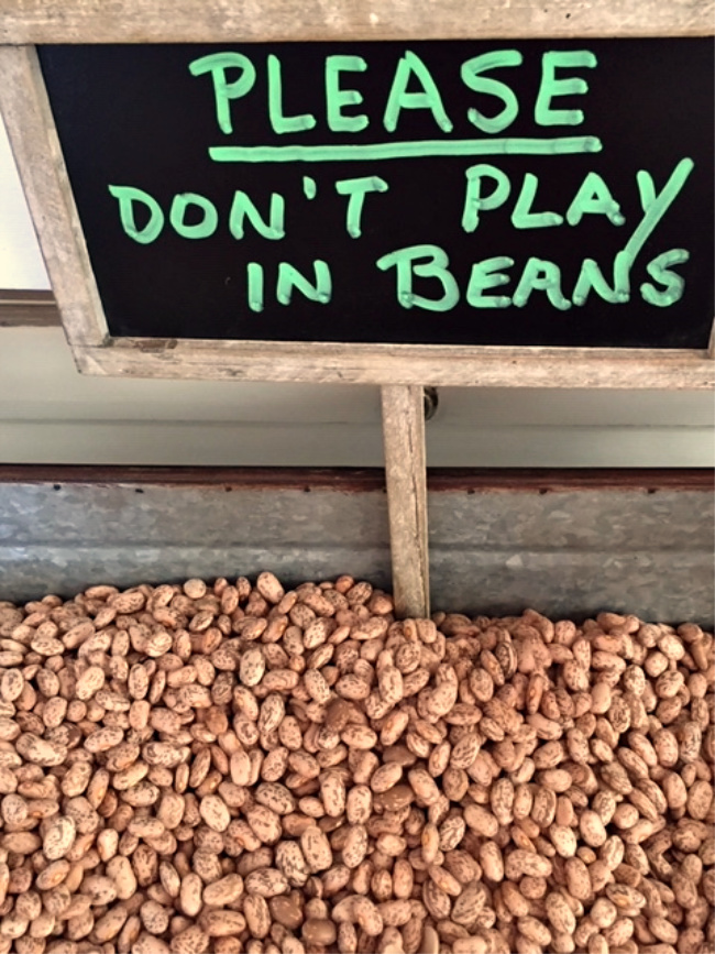 Please don't play in beans sign in dried beans