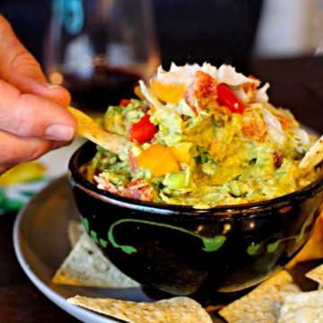 Bacon lettuce tomato guacamole served with tortilla chips.