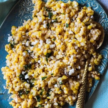 Mexican corn salad recipe served on a turquoise platter