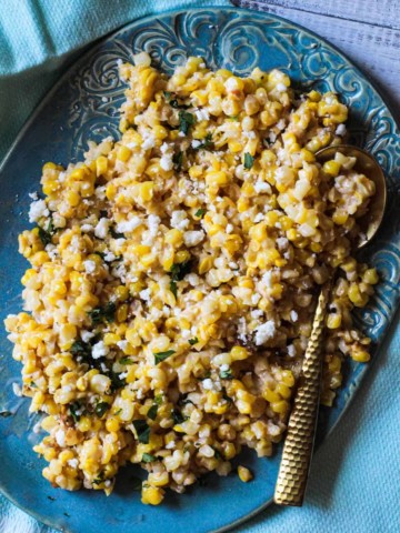 Mexican corn salad recipe served on a turquoise platter