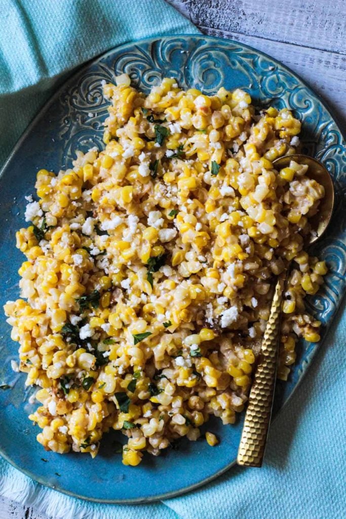 Mexican corn salad recipe served on a turquoise platter