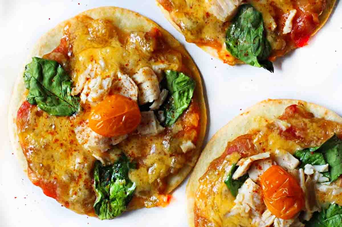 Southwestern flour tortilla pizza made with green chile sauce and chicken.