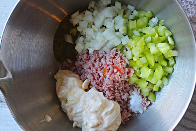 ingredients in a bowl for ham salad sandwich recipe.