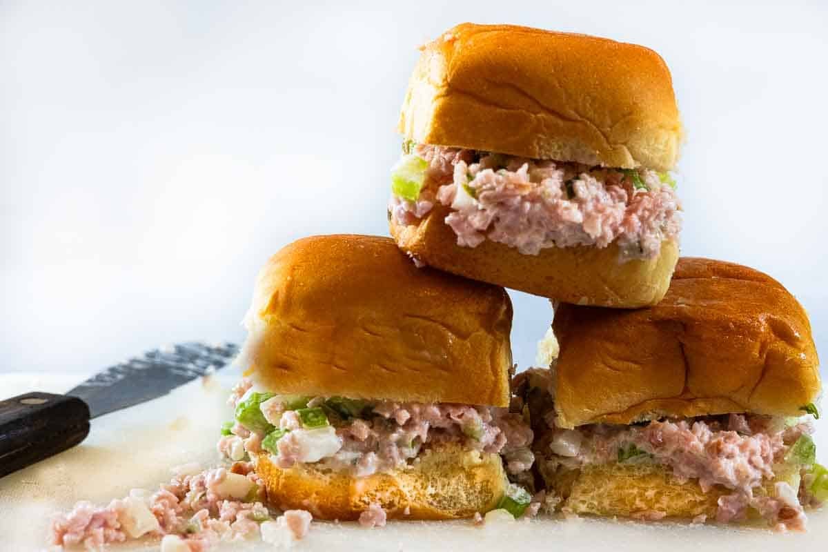 Three ham salad sandwich sliders on sweet Hawaiian rolls.