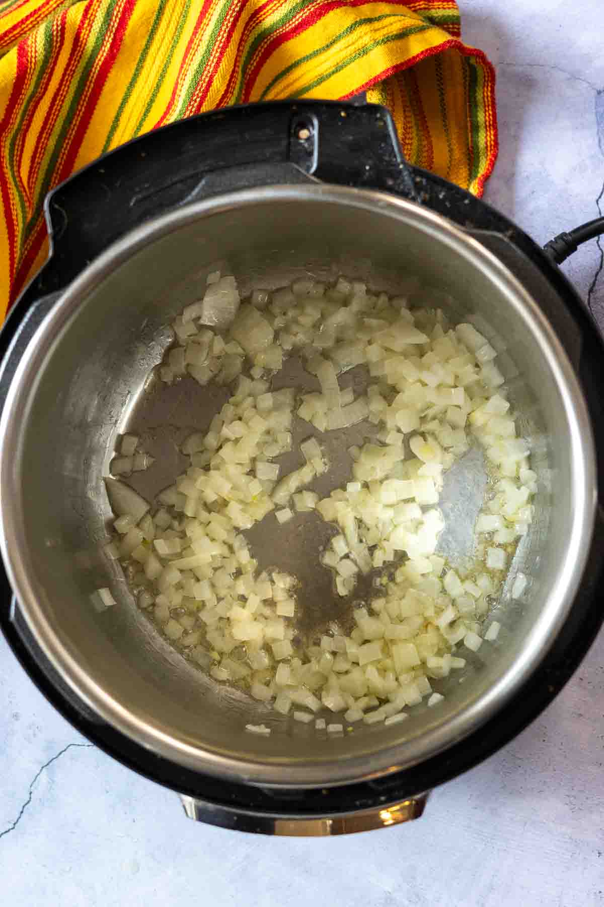 Cooking diced onions in the instant pot.