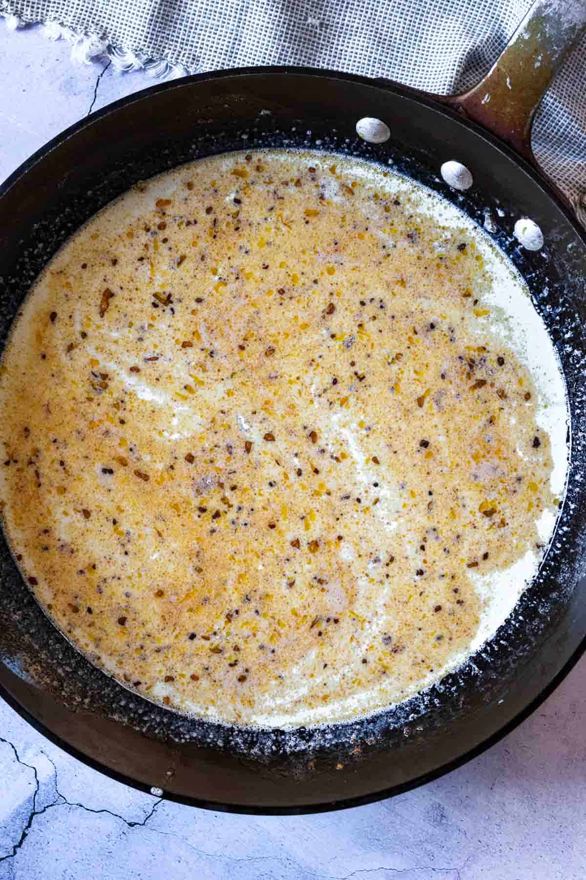 Step two to make lemon cream sauce for pasta with ham and peas.
