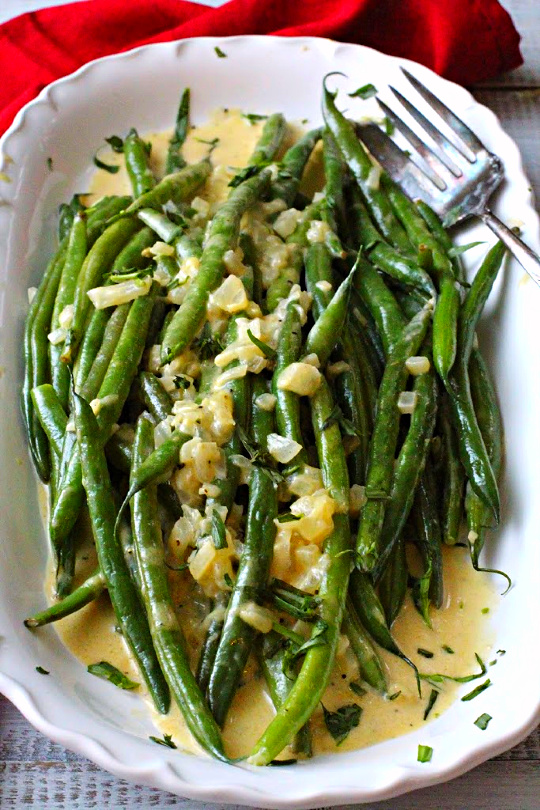 Hericot vert recipe topped with shallots and cooked in a dijon mustard sauce