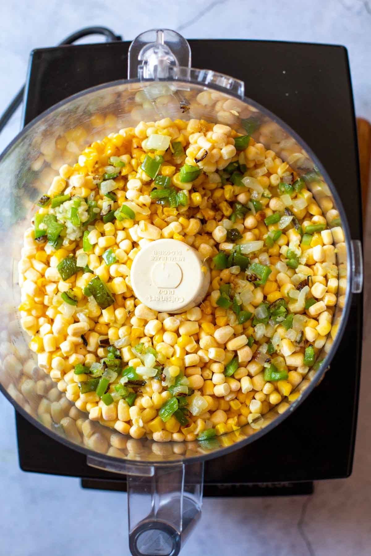 Grinding corn in a food processor.