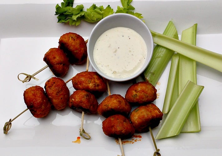 Chicken meatballs glazed in buffalo wing sauce served with blue cheese dressing and celery sticks.