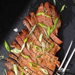 A grilled sliced flank steak that's been marinated overnight.