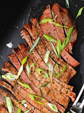 A grilled sliced flank steak that's been marinated overnight.