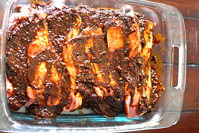 Pork steaks covered with Red Chile Sauce to make Tacos Al Pastor