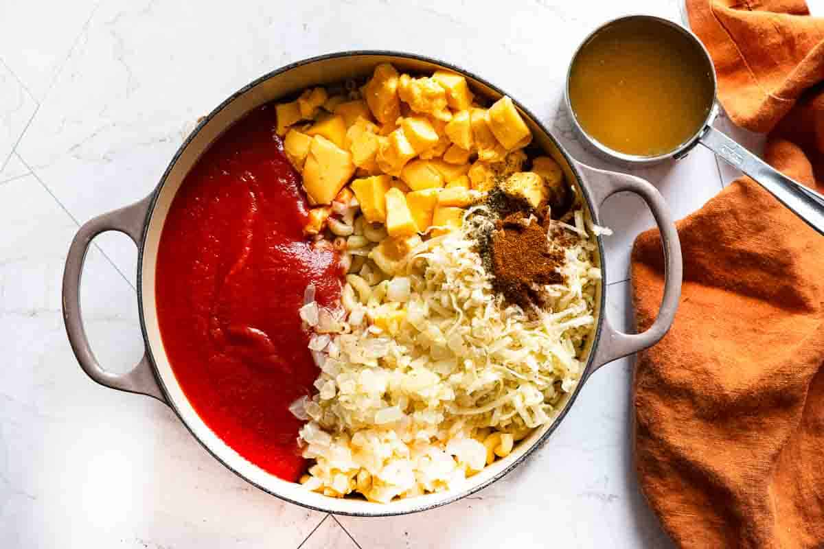 Combining all ingredients to Make Mexican mac and cheese.