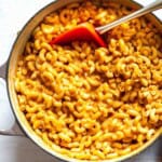 Mexican mac and cheese cooked stovetop in a Dutch oven.