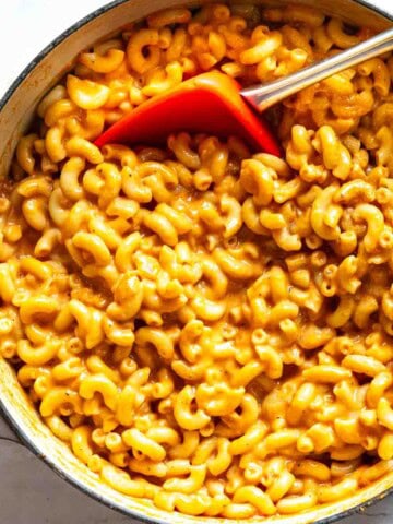 Mexican mac and cheese cooked stovetop in a Dutch oven.