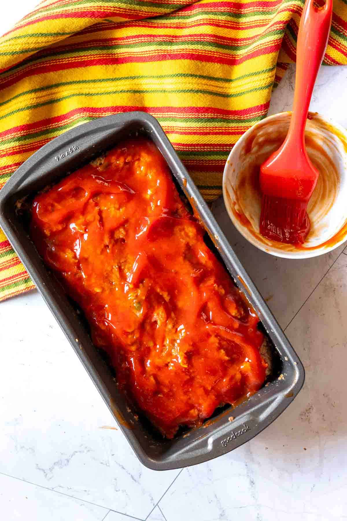 Glazed spicy meatloaf in a loaf pan, step 4.