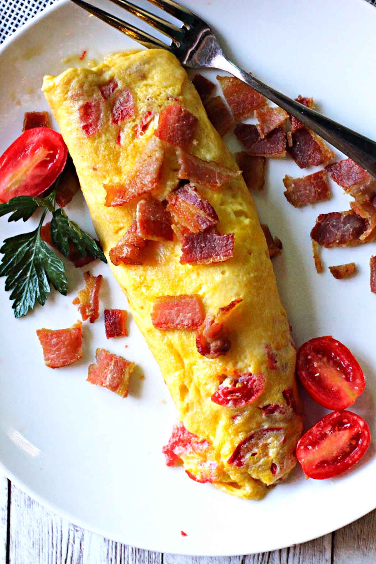 2-egg Omelette topped with bacon and garnished with cherry tomatoes