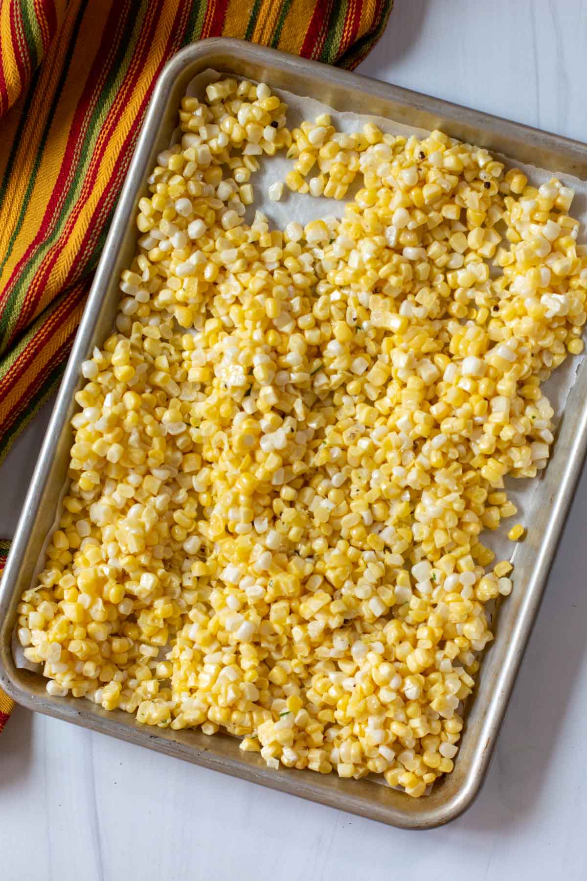 Corn kernels on a sheet pan.