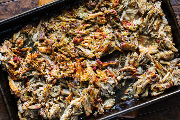 Instant Pot Canitas Recipe. Shredded pork on a sheet pan ready to broil in the oven to make the pork crispy