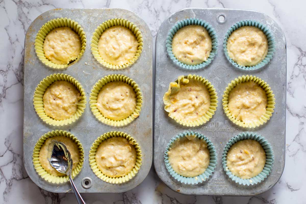 Filling muffins tins with corn muffin batter