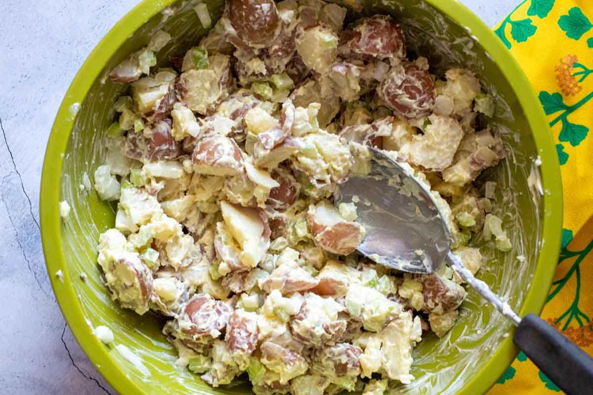 Easy classic potato salad in a large green bowl.