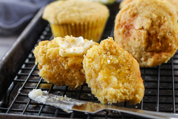 Jalapeno Jelly Corn Bread Muffins cut in half and spread with butter for corn muffins recipe