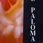 Tequila grapefruit juice cocktail with sliced grapefruit wedge