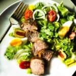 Oven baked pork tenderloin served with a tossed salad