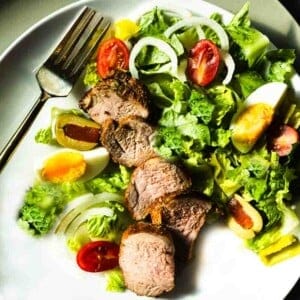 Oven baked pork tenderloin served with a tossed salad