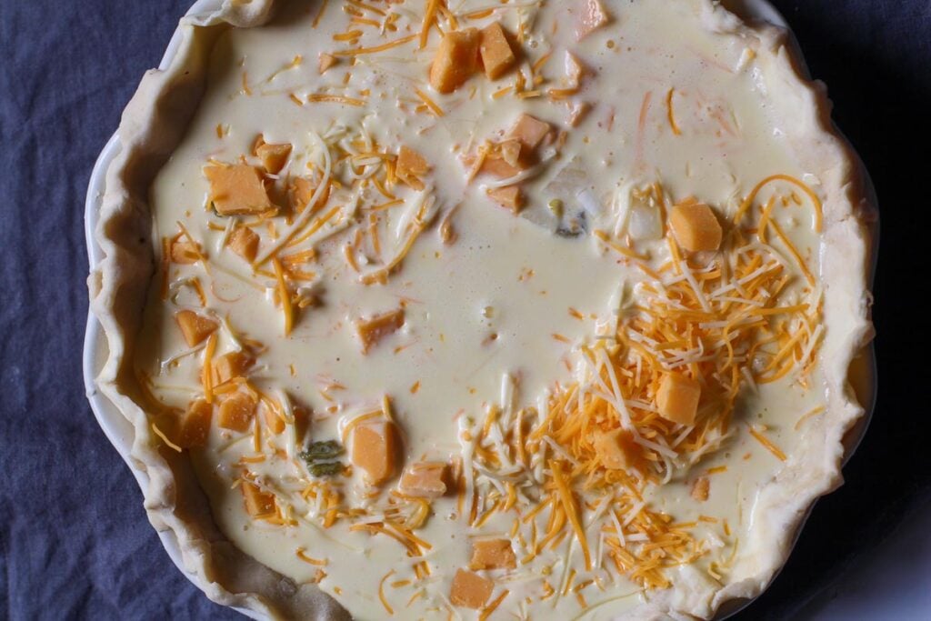 Half and Half and cheese in a pie shell for hatch chile quiche