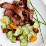 Asian marinade for grilled flank steak served with asian cucumbers and garnished with chives
