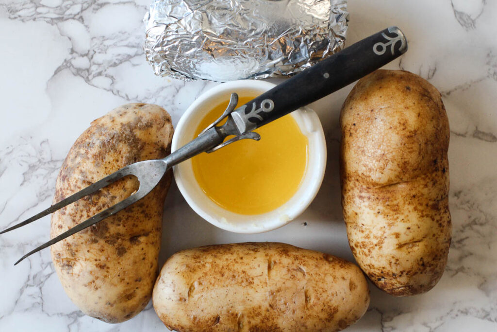 Slow Cooker Baked potatoes with garlic butter