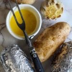 Slow Cooker Baked Potatoes served with garlic butter