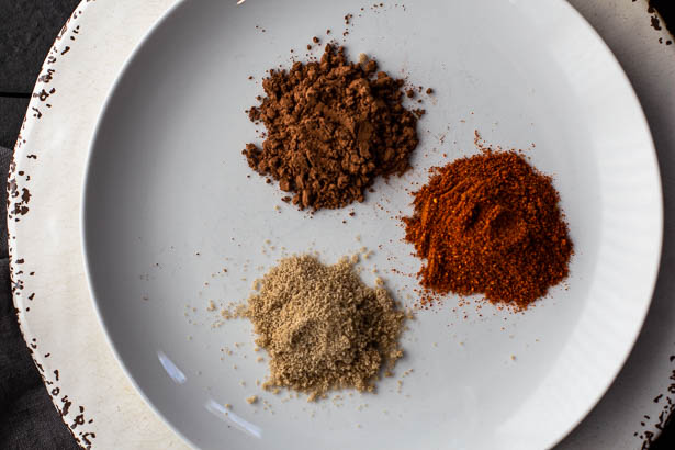 Cocoa powder, New Mexico Chile Powder and brown sugar for grilled pork chop seasoning