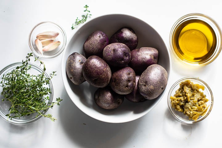 Ingredients for purple potatoes roasted with garlic and chile peppers