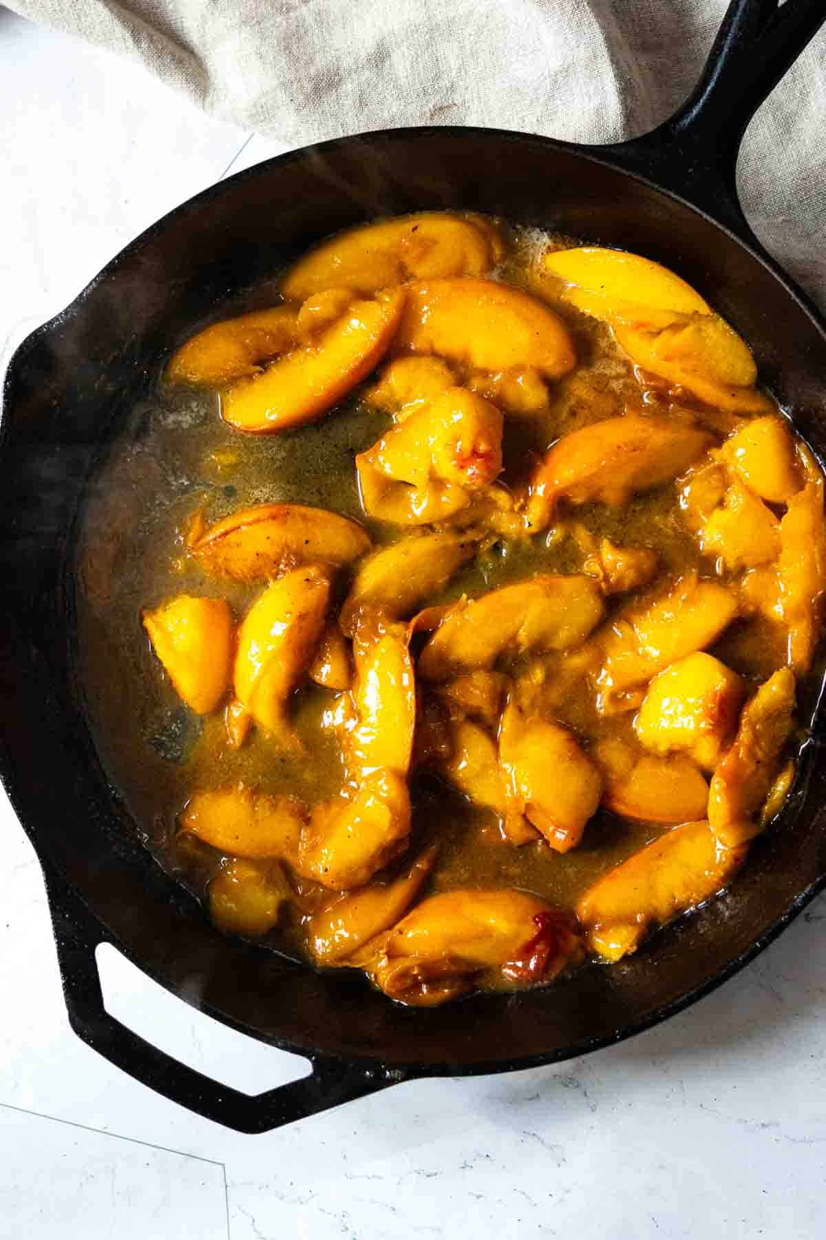 Making peach bourbon sauce for Pork Tenderloin Medallions.