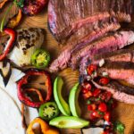 Flank Steak Fajitas with grilled vegetables, avocados and flour tortillas