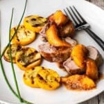 Pork Tenderloin Medallions with peach bourbon compote sauce.