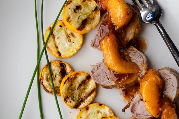 Pork tenderloin medallions with bourbon peaches and grilled summer squash