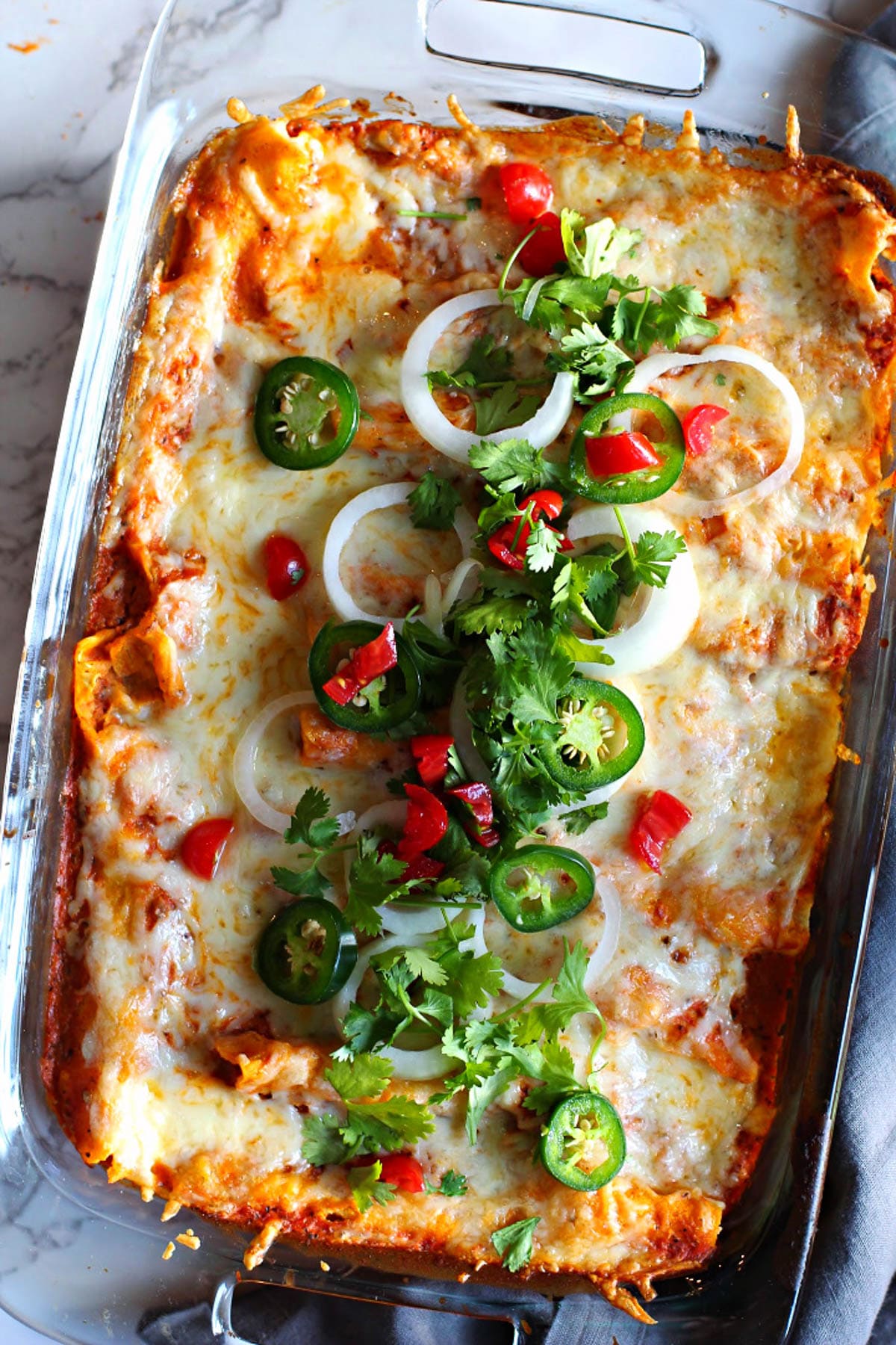 Chicken enchilada casserole with tomato cream sauce