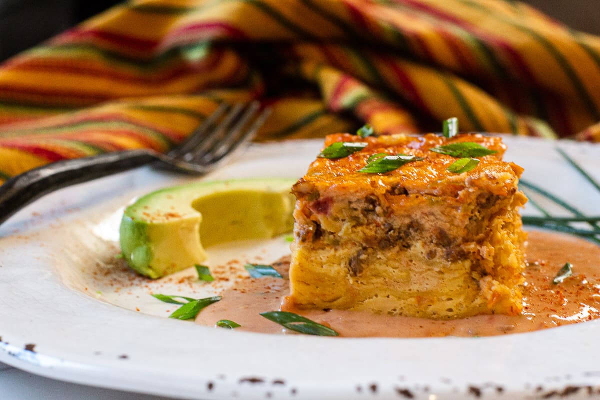 Mexican Breakfast Casserole with chorizo and corn tortillas with velveeta cheese sauce