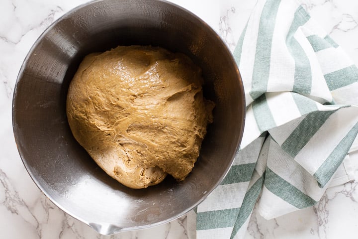 placing dough in an oiled bowl for its first rise