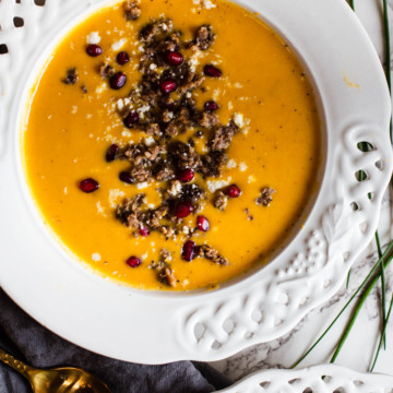Curried butternut squash soup topped with Jimmy Dean Sausage, pomegranate seeds and cotija cheese