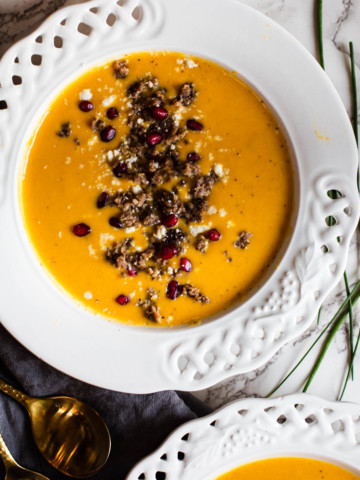 Curried butternut squash soup topped with Jimmy Dean Sausage, pomegranate seeds and cotija cheese