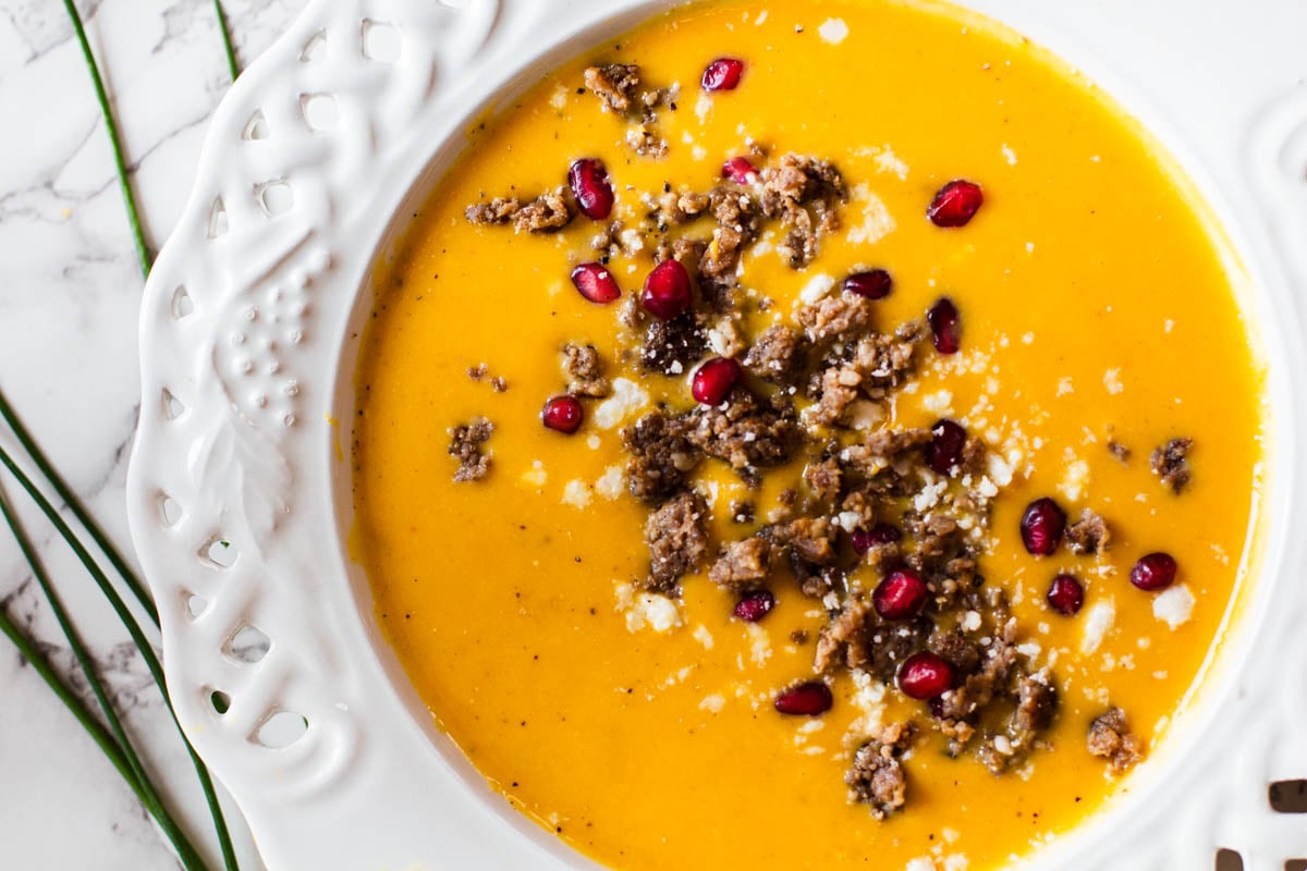 Butternut squash soup topped with crumbled breakfast Breakfast sausage, pomegranate seeds and feta.